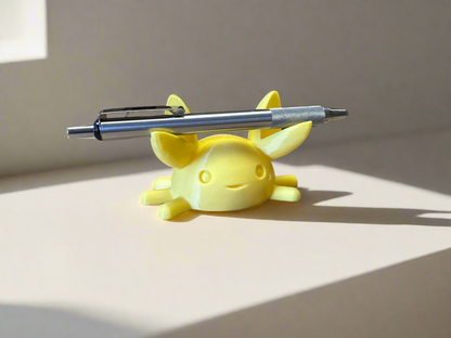 A cute crab pen holder resting on a desk, proudly holding a fountain pen in its claws