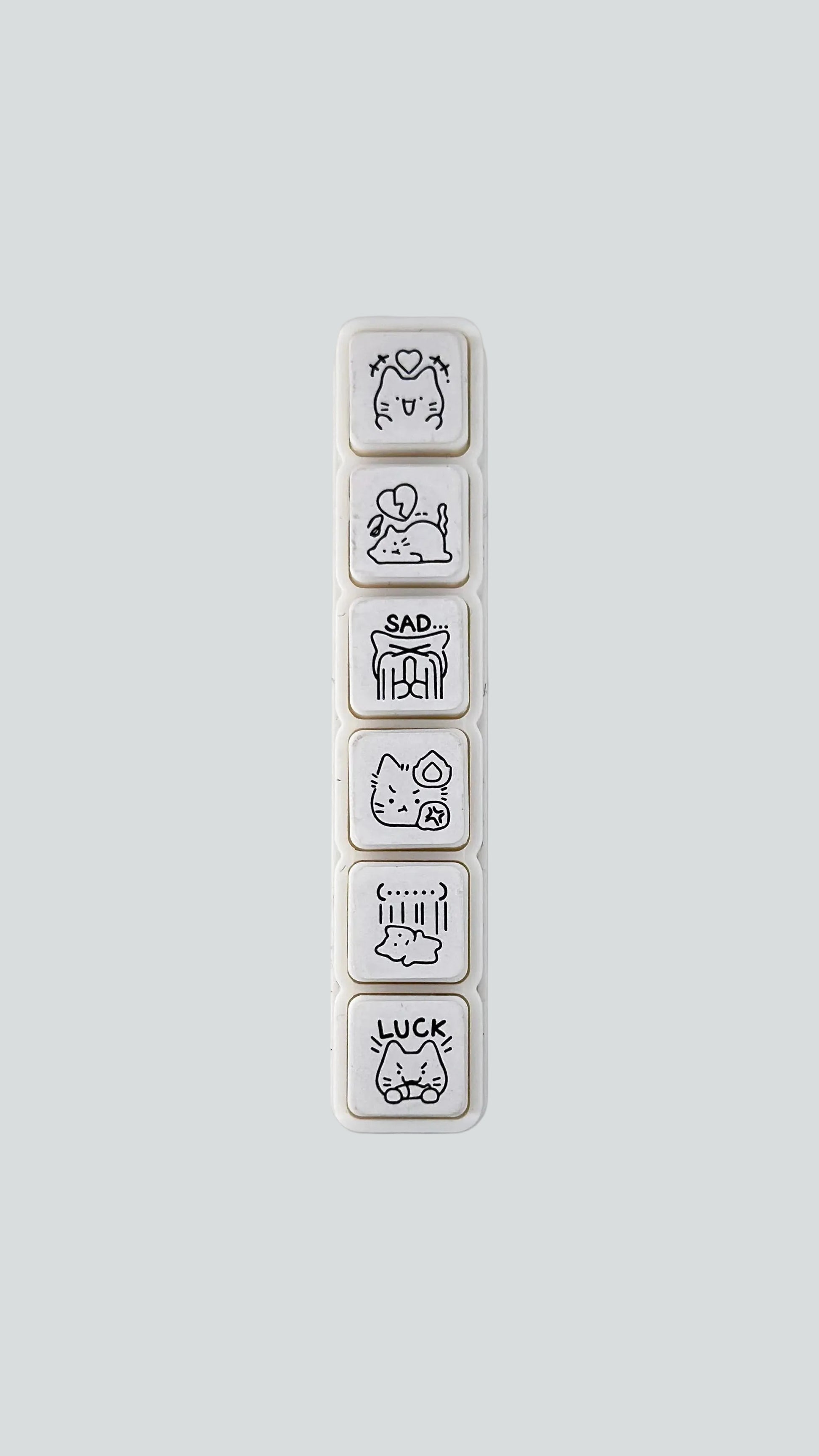 Simno Cat Emotions 6-button push stamp showing its six self-inking, emotion-themed cat icons.