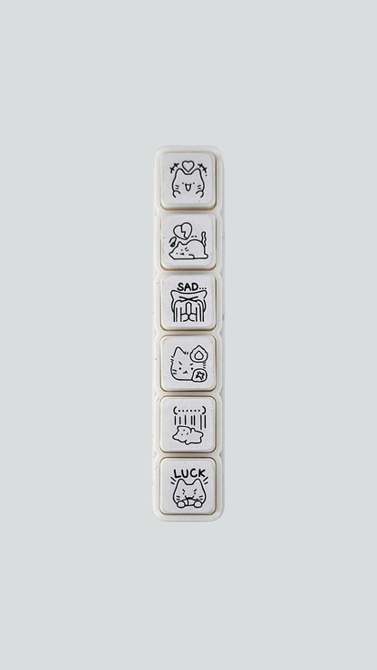 Simno Cat Emotions 6-button push stamp showing its six self-inking, emotion-themed cat icons.