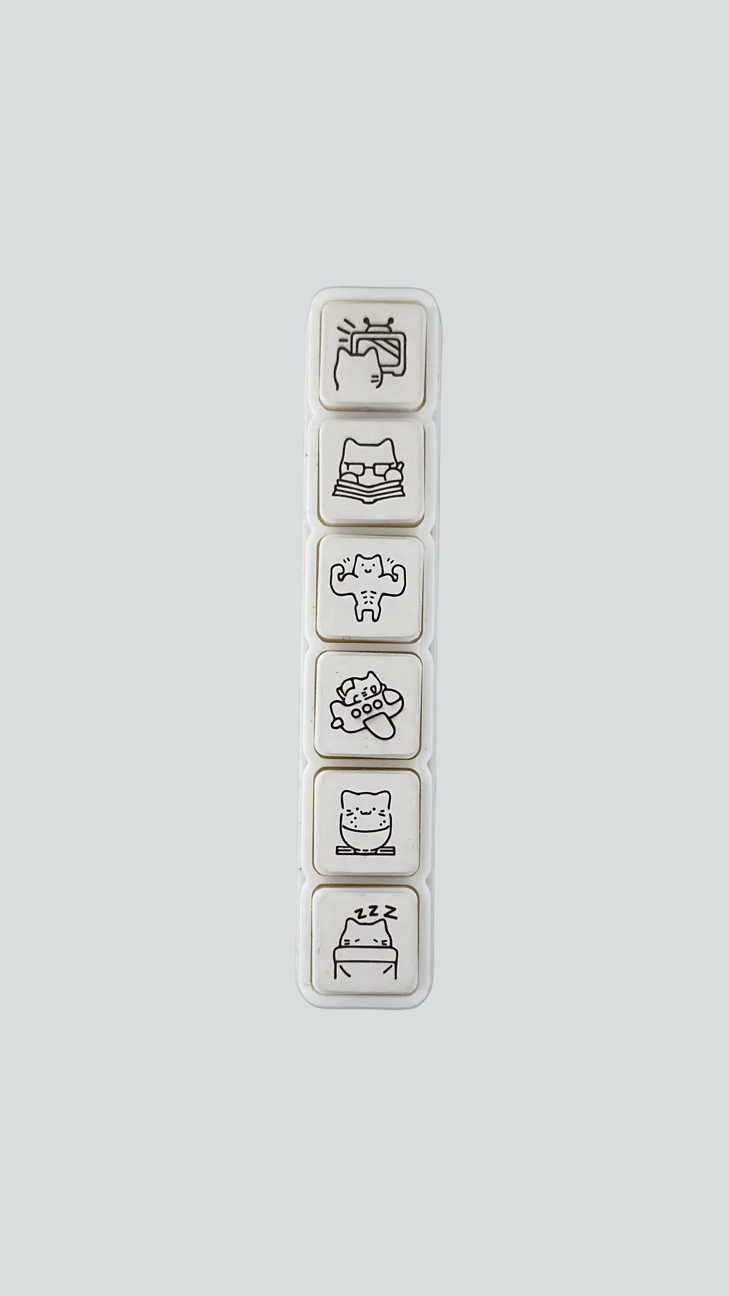 Simno Cat Vacation 6-button push stamp showing its six self-inking, travel-themed cat icons.