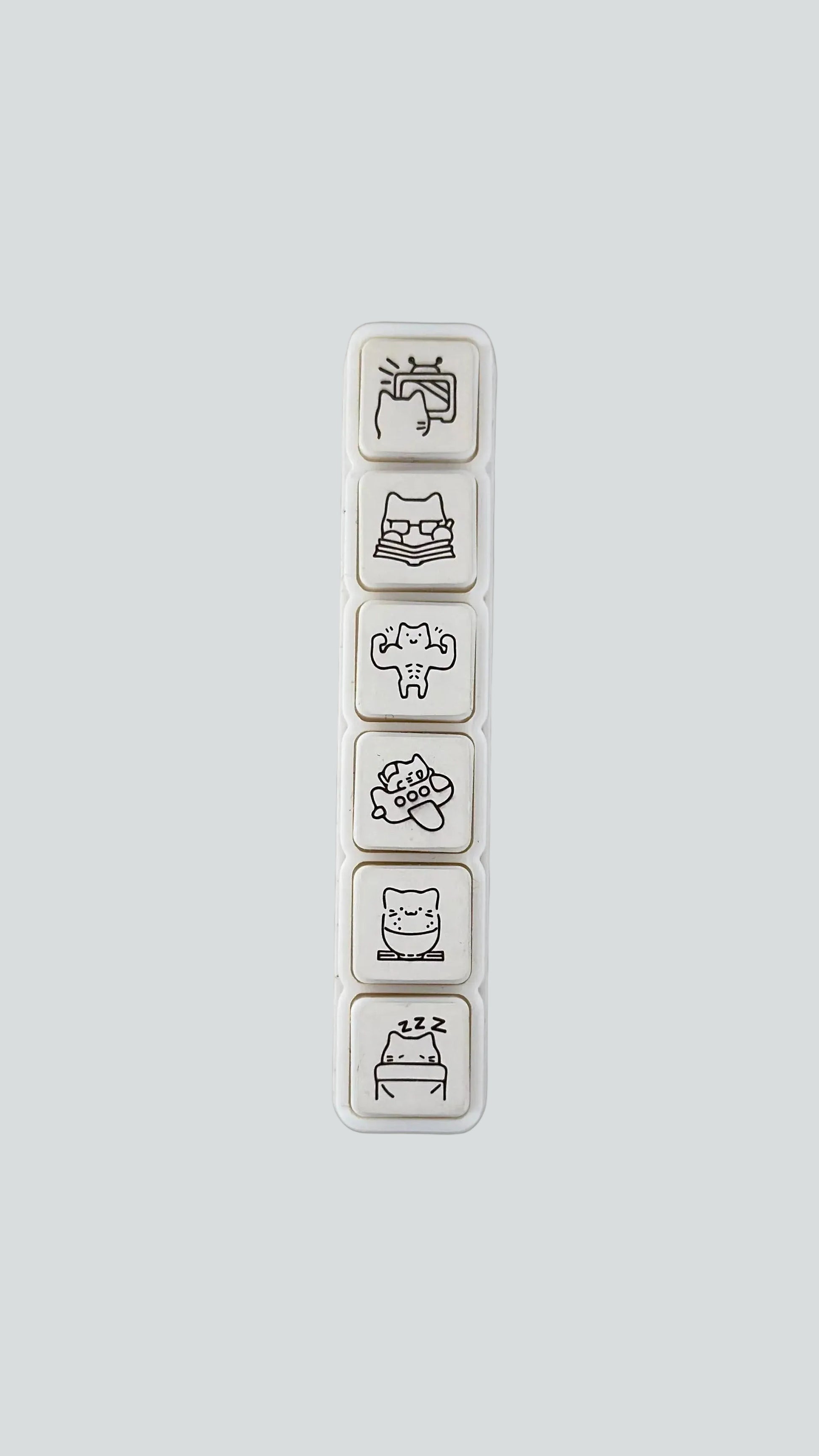 Simno Cat Vacation 6-button push stamp showing its six self-inking, travel-themed cat icons.