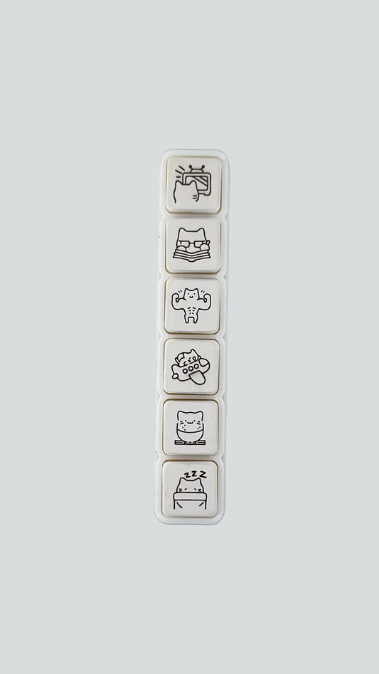 Simno Cat Vacation 6-button push stamp showing its six self-inking, travel-themed cat icons.