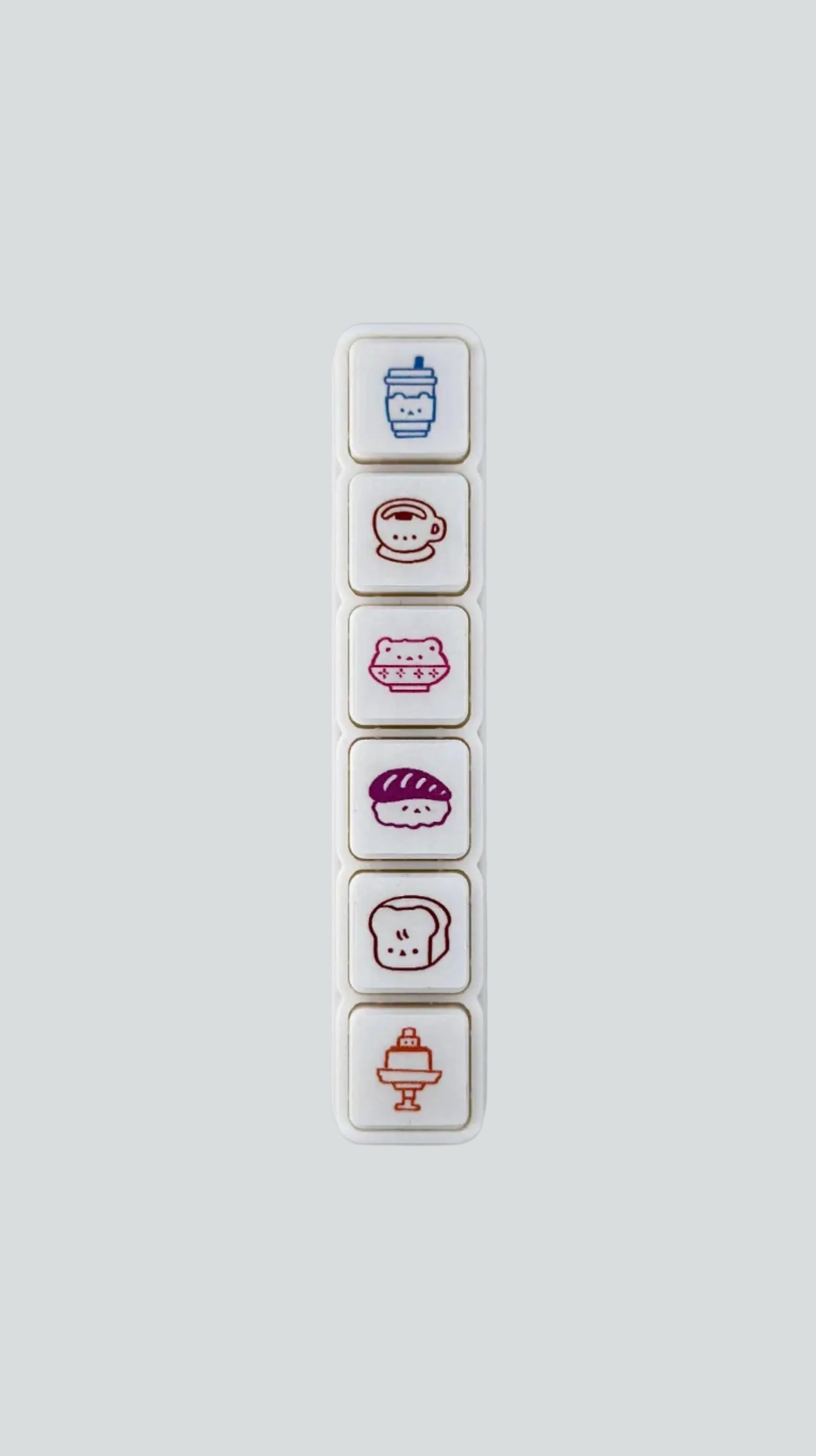 Wetape Food Faces 6-button push stamp featuring six self-inking, kawaii food icons.