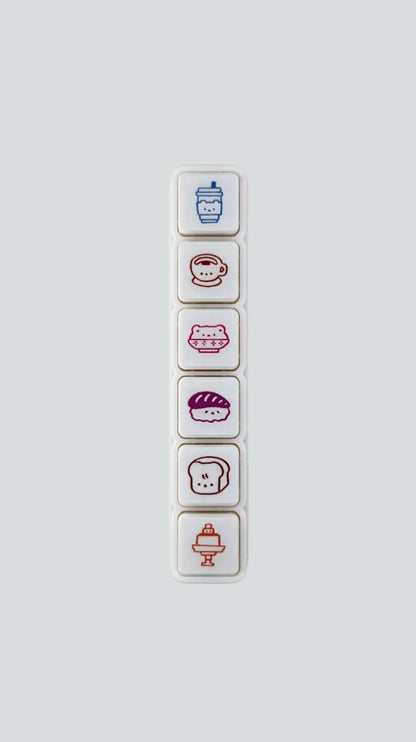 Wetape Food Faces 6-button push stamp featuring six self-inking, kawaii food icons.