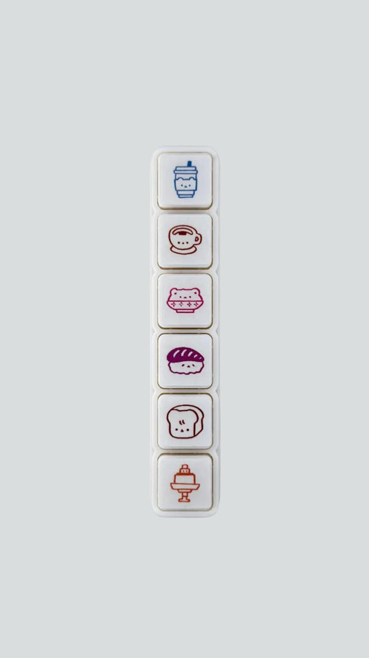 Wetape Food Faces 6-button push stamp featuring six self-inking, kawaii food icons.